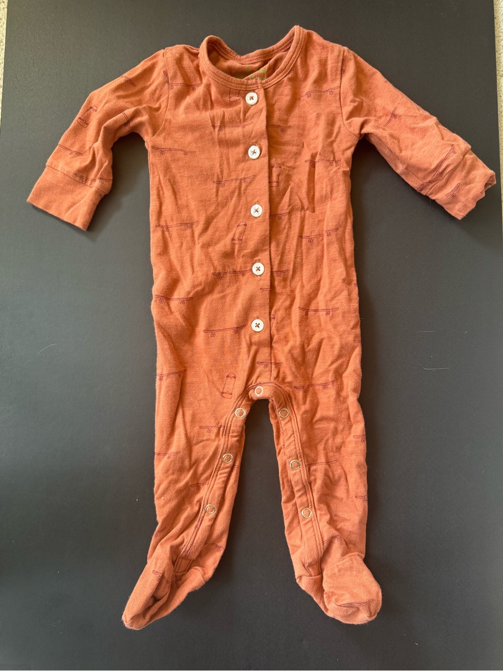 kate quinn Rust Orange Footed One-Piece with Skateboard Print